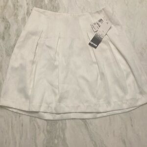 Kenzie, white pleated skirt.